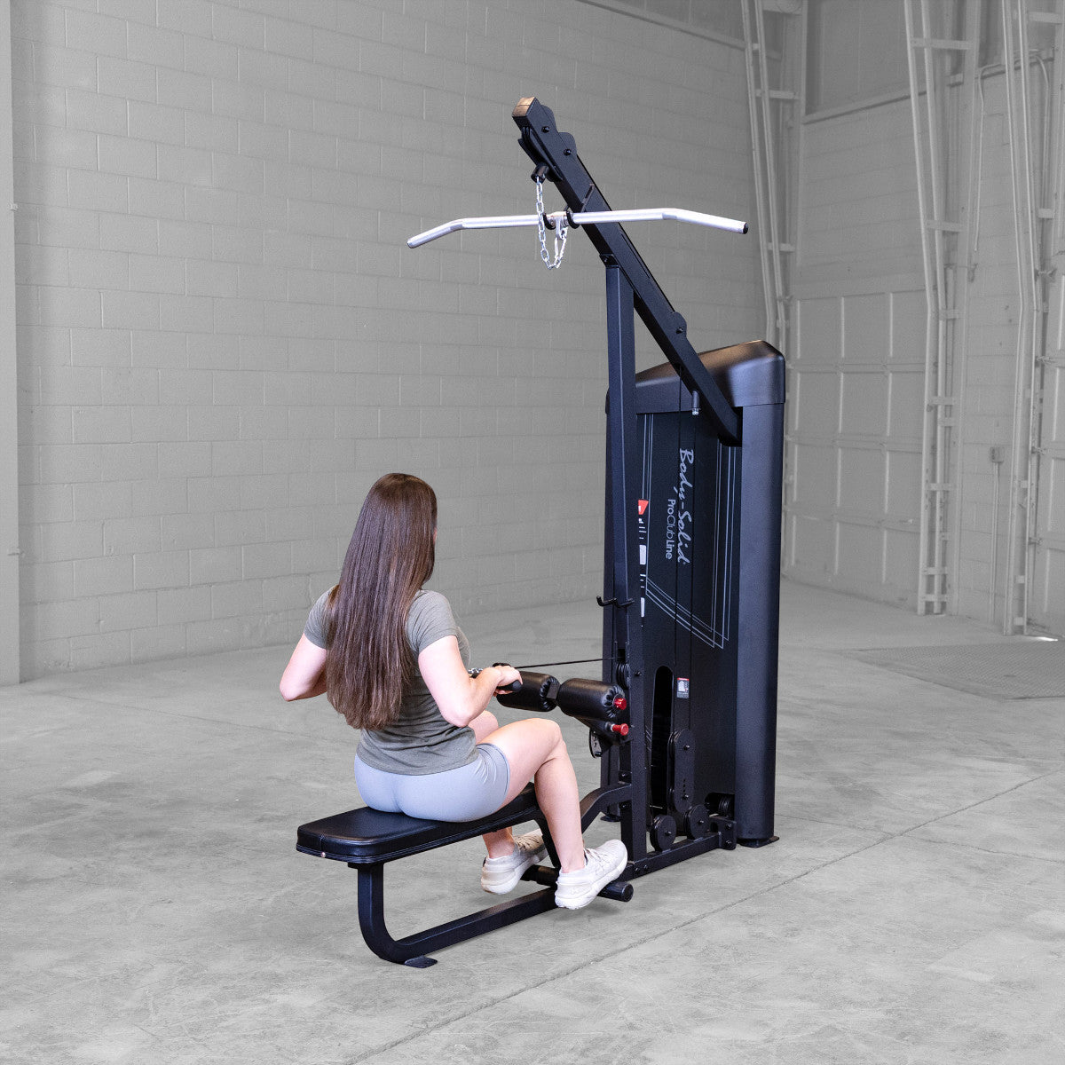 Body-Solid S2LATX Pro ClubLine Series 2 Dual Lat & Seated Row Machine with woman exercising