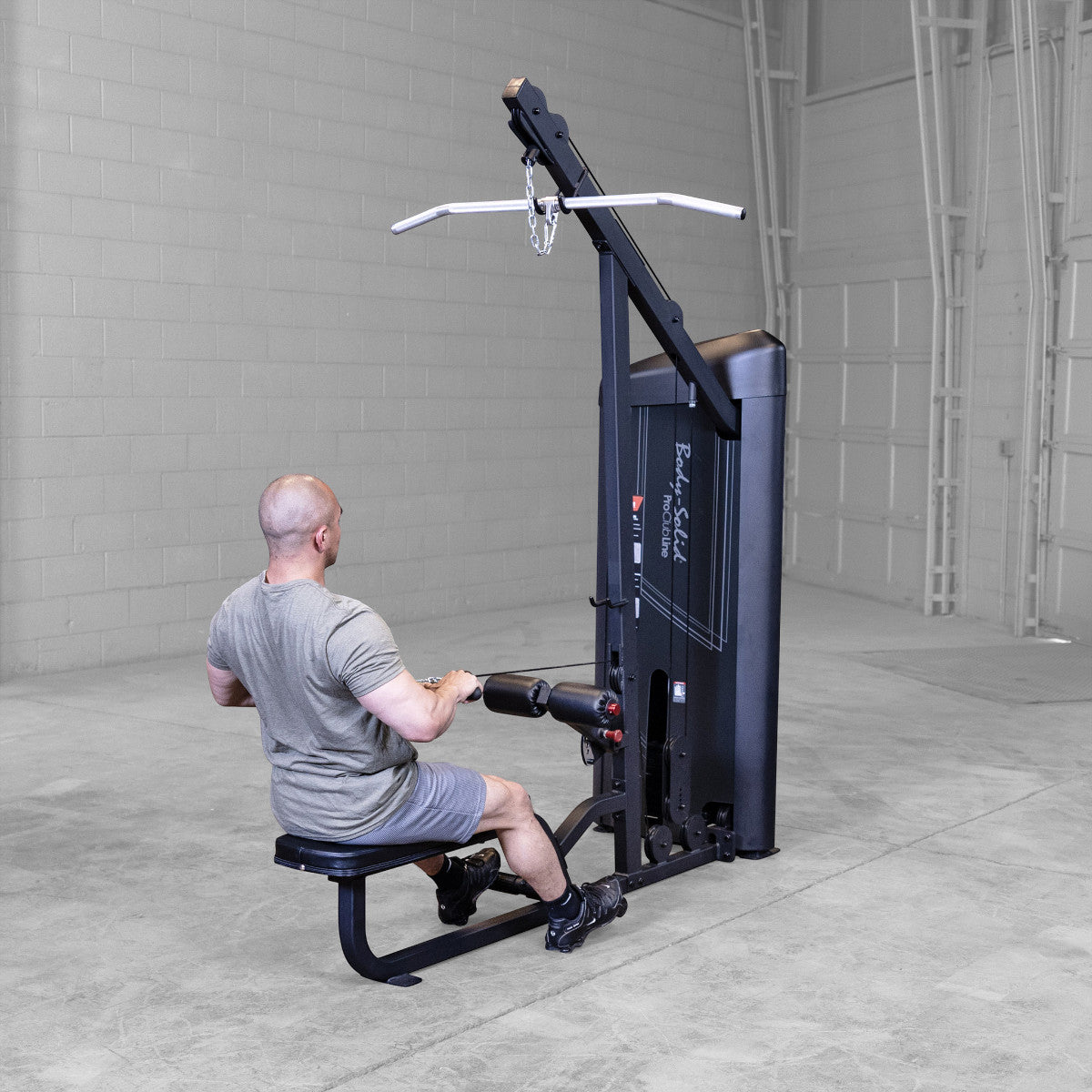 Body-Solid S2LATX Pro ClubLine Series 2 Dual Lat & Seated Row Machine with man exercising