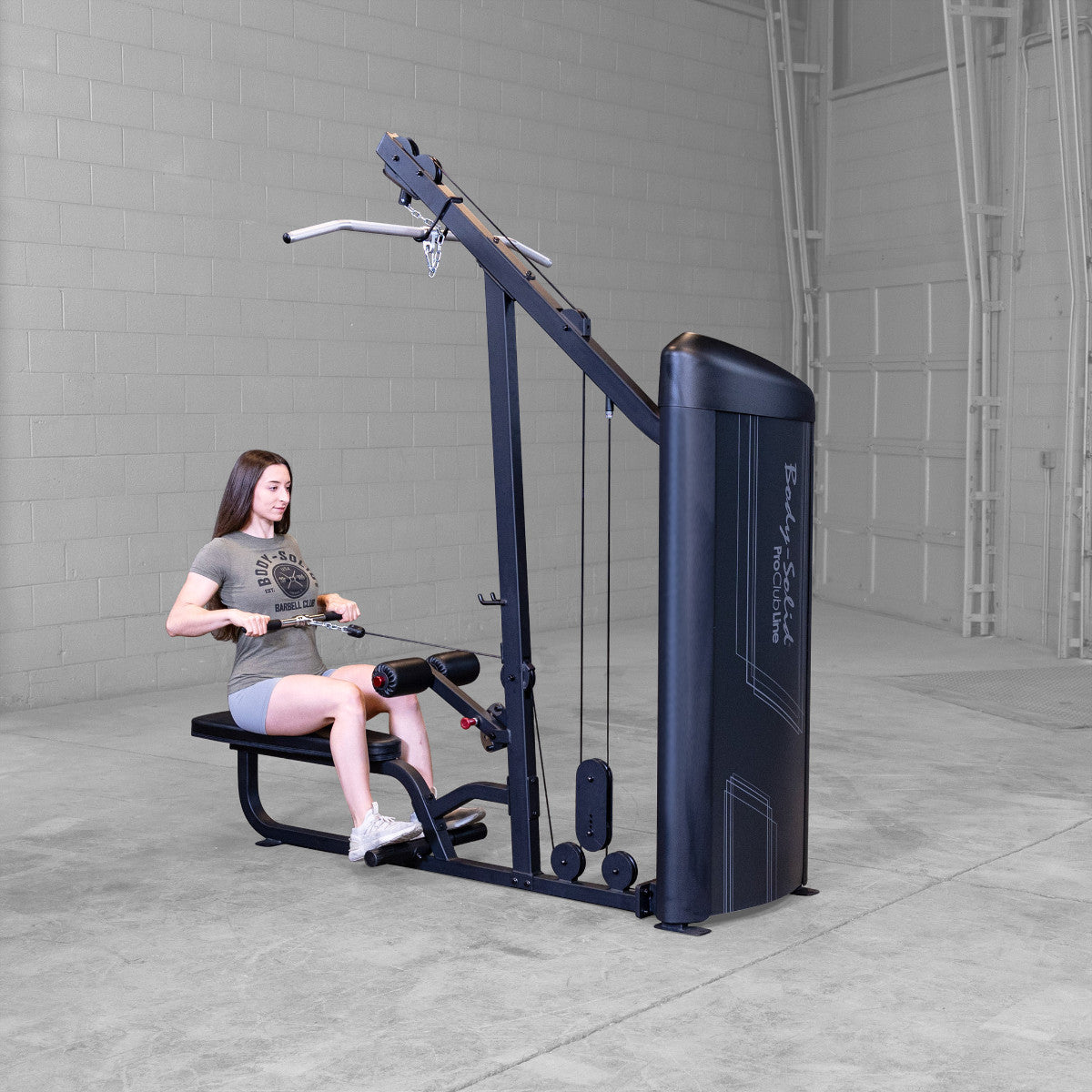 Body-Solid S2LATX Pro ClubLine Series 2 Dual Lat & Seated Row Machine with woman exercising