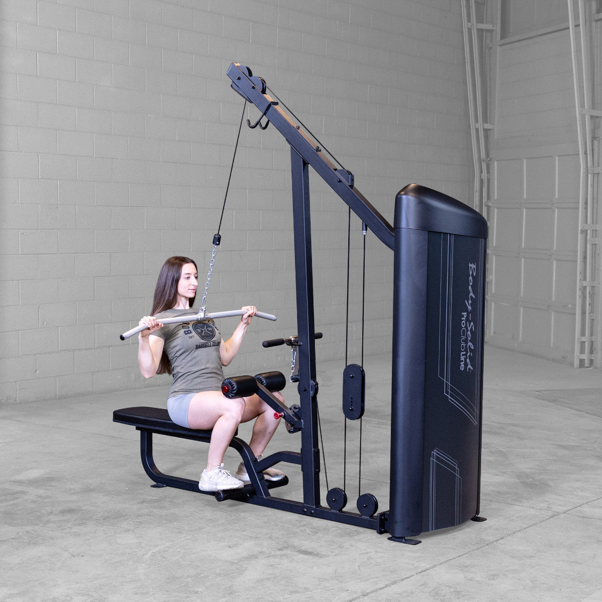 Body-Solid S2LATX Pro ClubLine Series 2 Dual Lat & Seated Row Machine with woman exercising