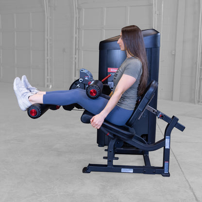 Body-Solid S2LECX Pro ClubLine Series 2 Dual Leg Curl & Extension Machine in gym with woman exercising