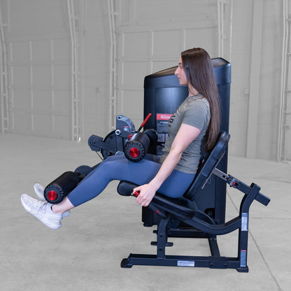 Body-Solid S2LECX Pro ClubLine Series 2 Dual Leg Curl & Extension Machine in gym with woman exercising