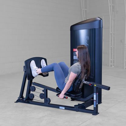 Body-Solid S2LPCX Pro ClubLine Series 2 Leg & Calf Press in gym with woman exercising.