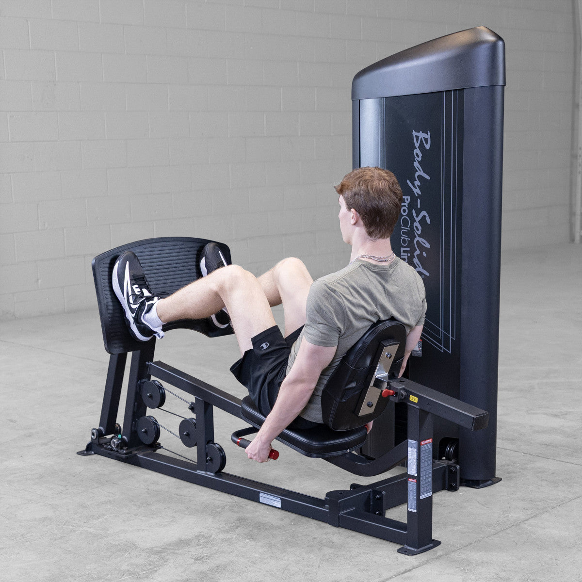 Body-Solid S2LPCX Pro ClubLine Series 2 Leg & Calf Press in gym with man exercising.