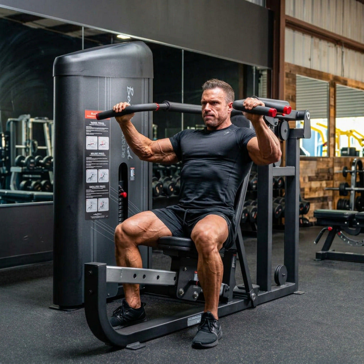 Body-Solid S2MPX Pro ClubLine Series 2 Flat, Incline, & Shoulder Press Machine with bodybuilder working out