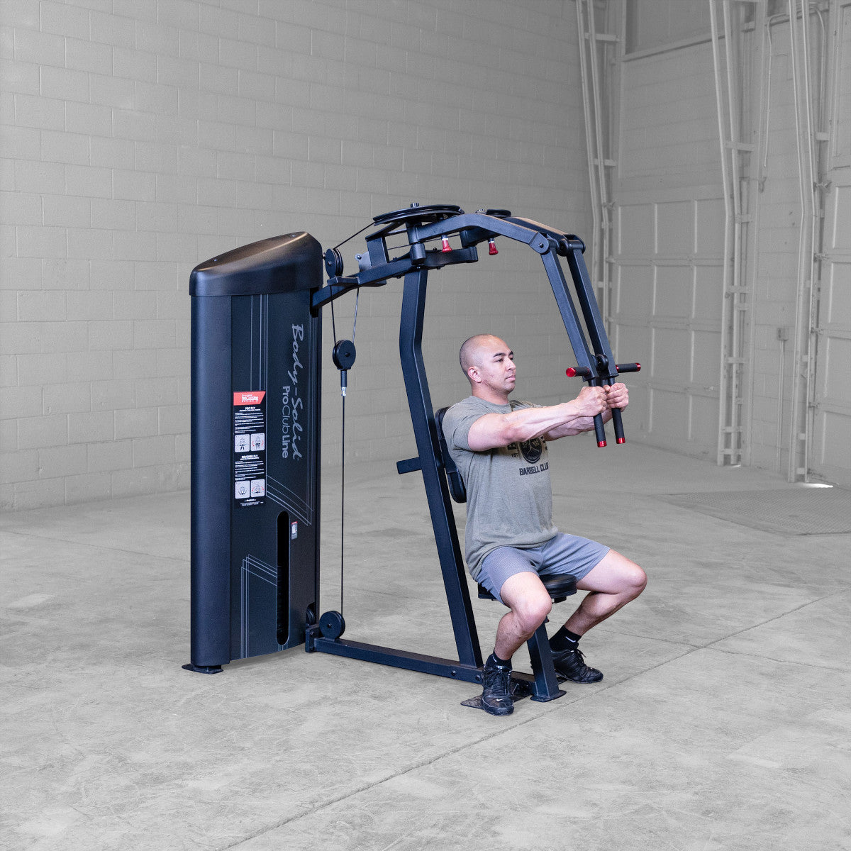 Body-Solid S2PECX Pro ClubLine Series 2 Dual Pec Fly & Rear Delt Machine in gym with man exercising