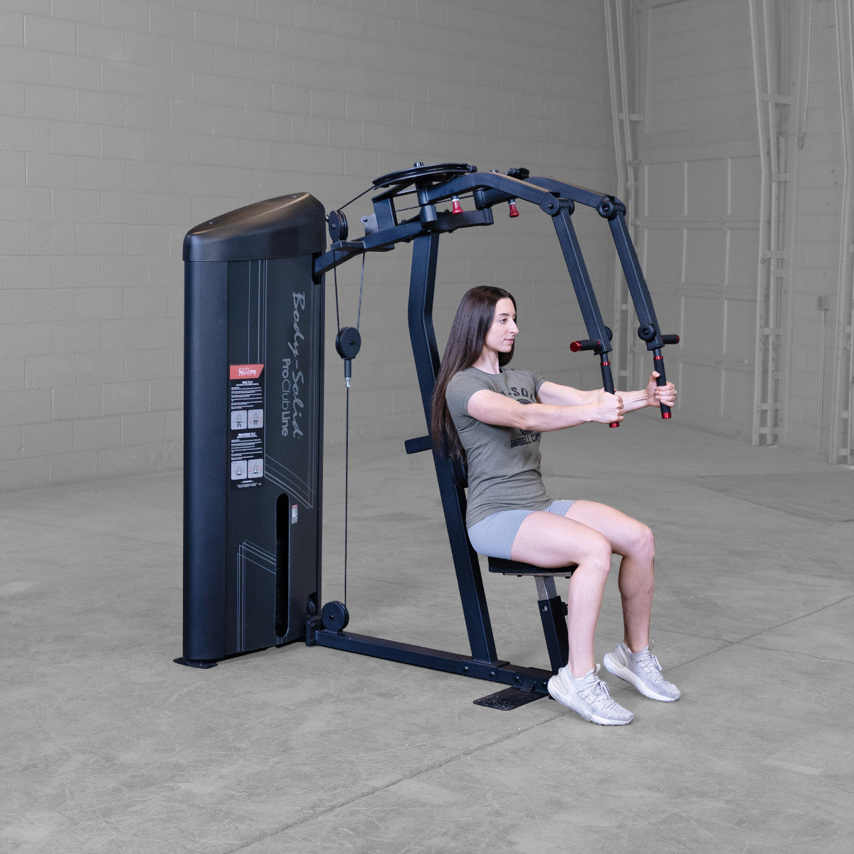 Body-Solid S2PECX Pro ClubLine Series 2 Dual Pec Fly & Rear Delt Machine in gym with woman exercising