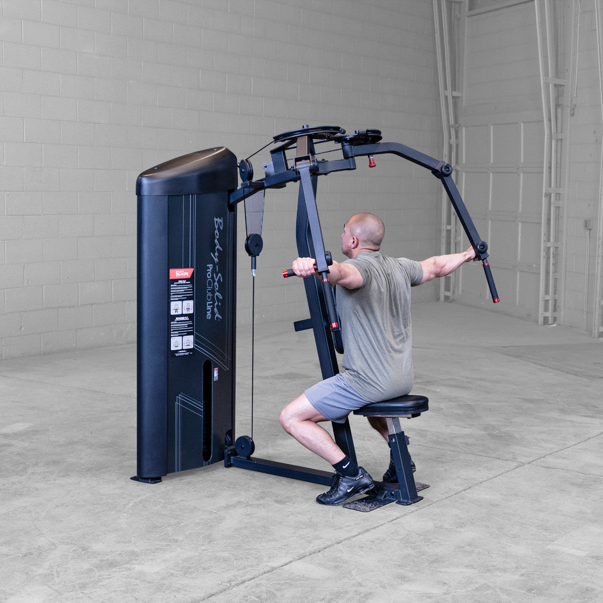 Body-Solid S2PECX Pro ClubLine Series 2 Dual Pec Fly & Rear Delt Machine in gym with man exercising