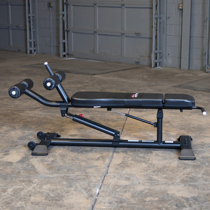 Body-Solid SAB500B Pro ClubLine Adjustable Decline Ab Bench at beach gym with woman doing ab crunches