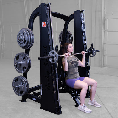 Body-Solid Pro ClubLine SCB1000B Counter Balanced Smith Machine woman exercising