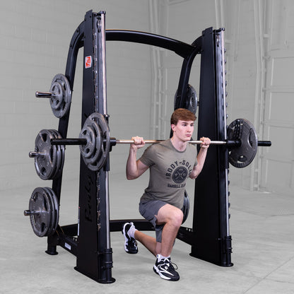 Body-Solid Pro ClubLine SCB1000B Counter Balanced Smith Machine man exercising