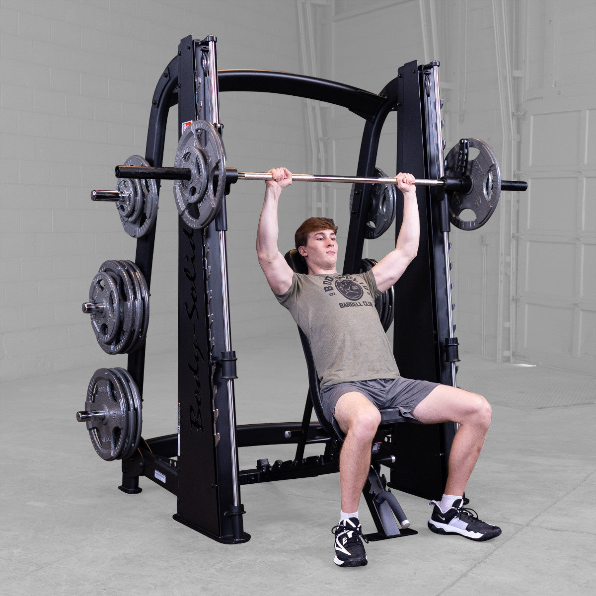 Body-Solid Pro ClubLine SCB1000B Counter Balanced Smith Machine man exercising