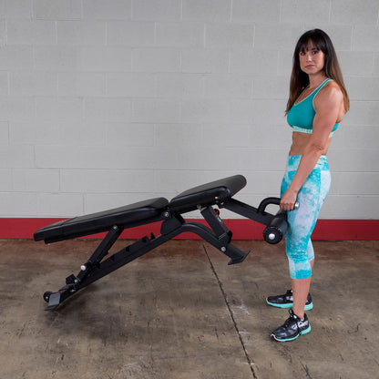 Woman moving a Body-Solid SFID425 Pro ClubLine Flat Incline Decline Bench