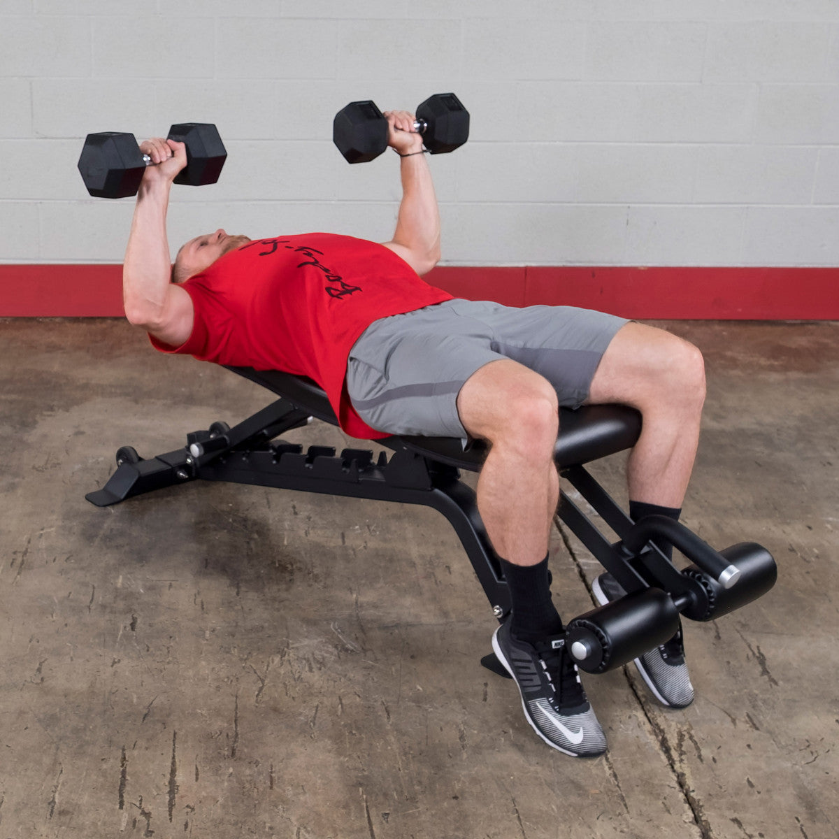Man working out on a Body-Solid SFID425 Pro ClubLine Flat Incline Decline Bench