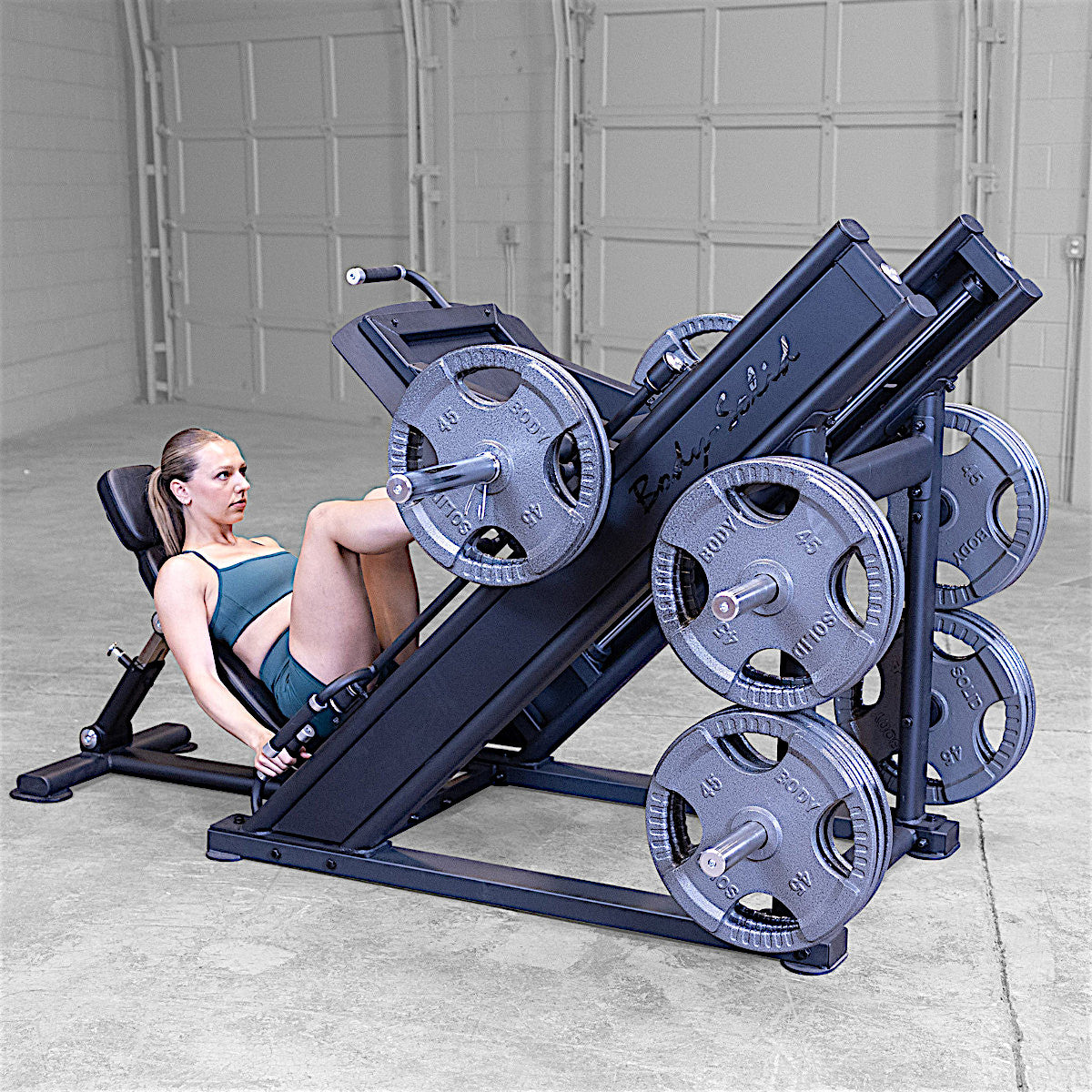 Body-Solid Pro Clubline SGLP500 Leg Press with woman exercising