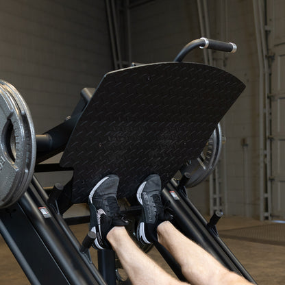 Body-Solid Pro Clubline SGLP500 Leg Press with man exercising calf's