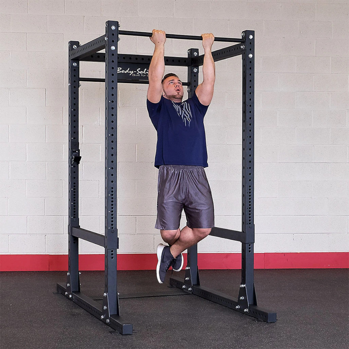 Body-Solid SPR1000 Commercial Power Rack man doing pullups