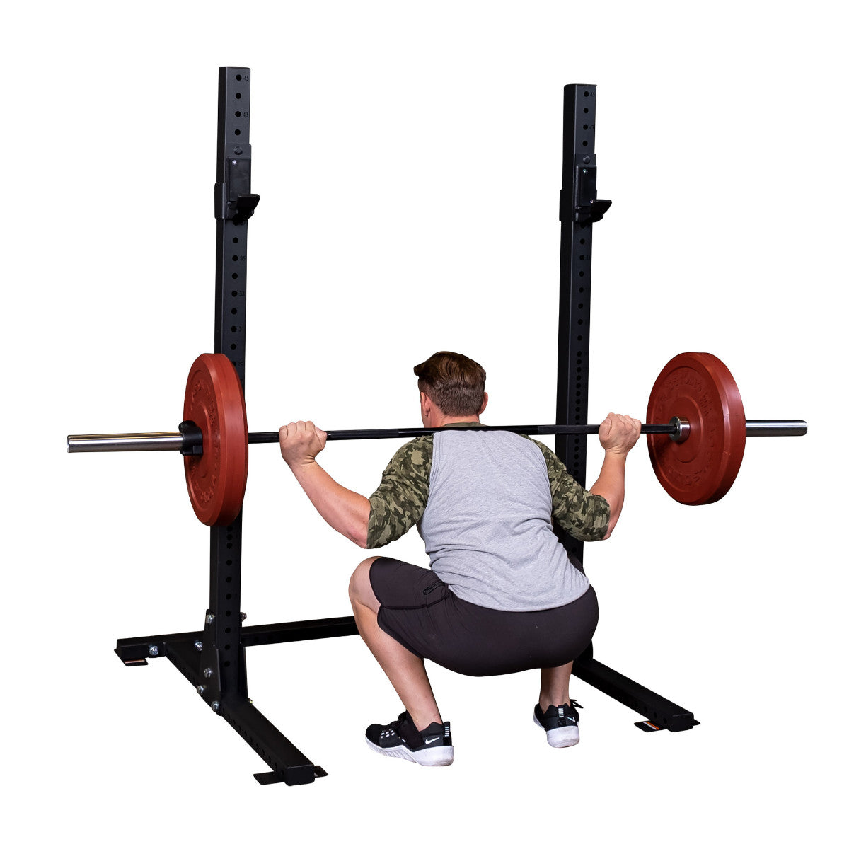 Body-Solid Pro ClubLine SPR250 Squat Rack man exercising