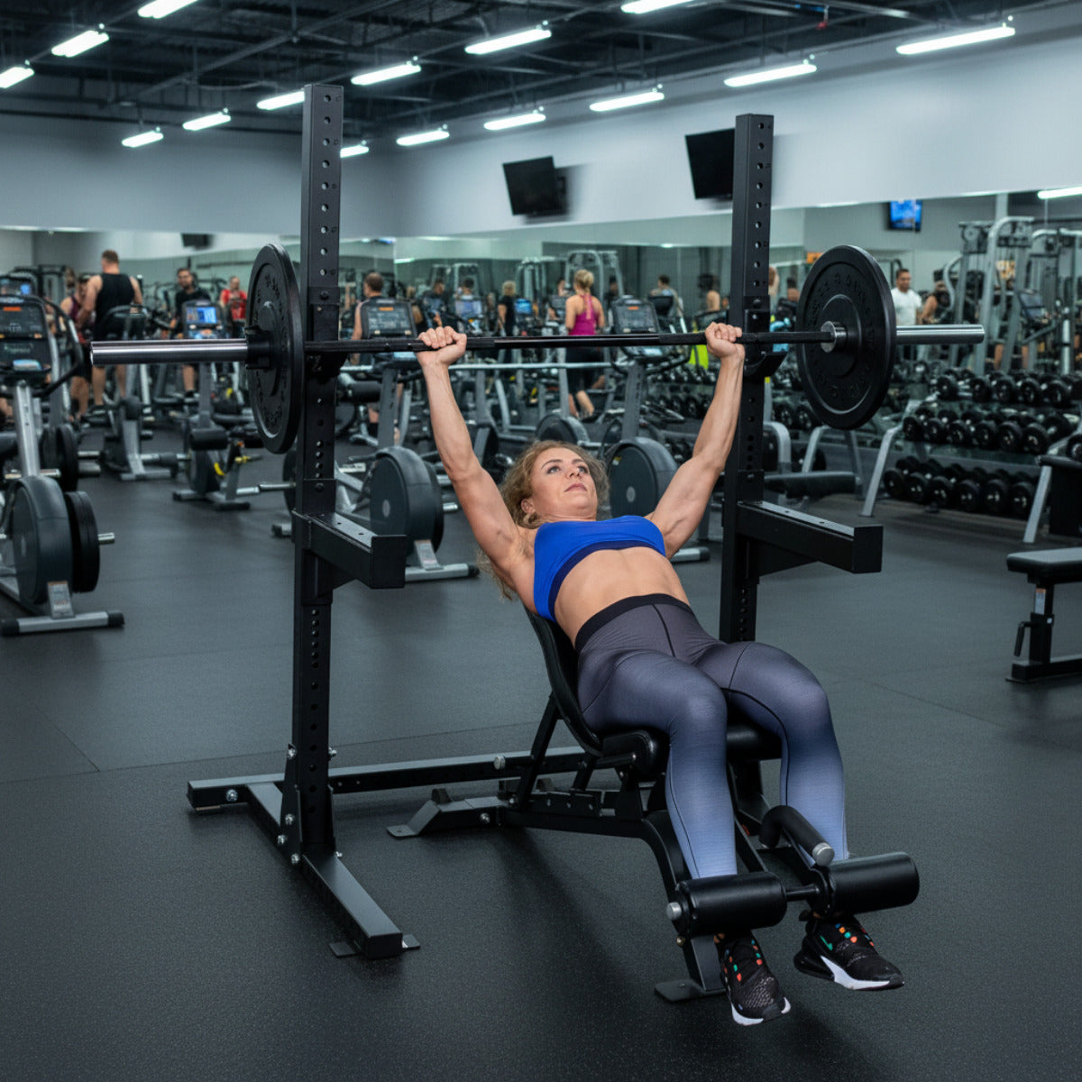 Body-Solid Pro ClubLine SPR250 Squat Rack in gym woman exercising