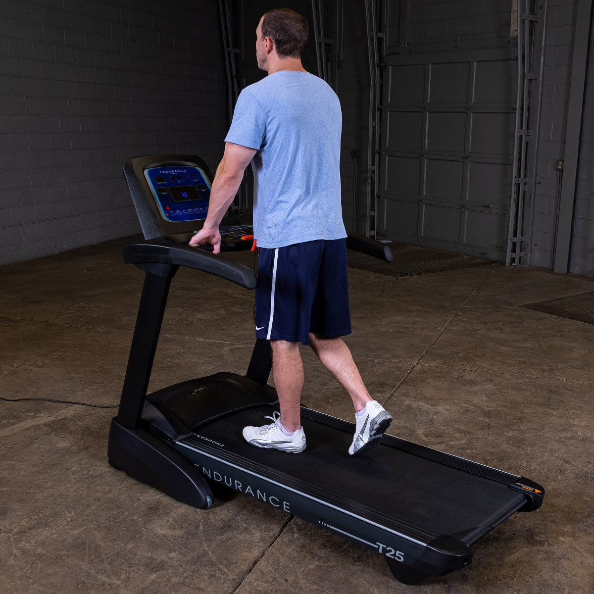 Body-Solid Endurance T25 Folding Treadmill man walking