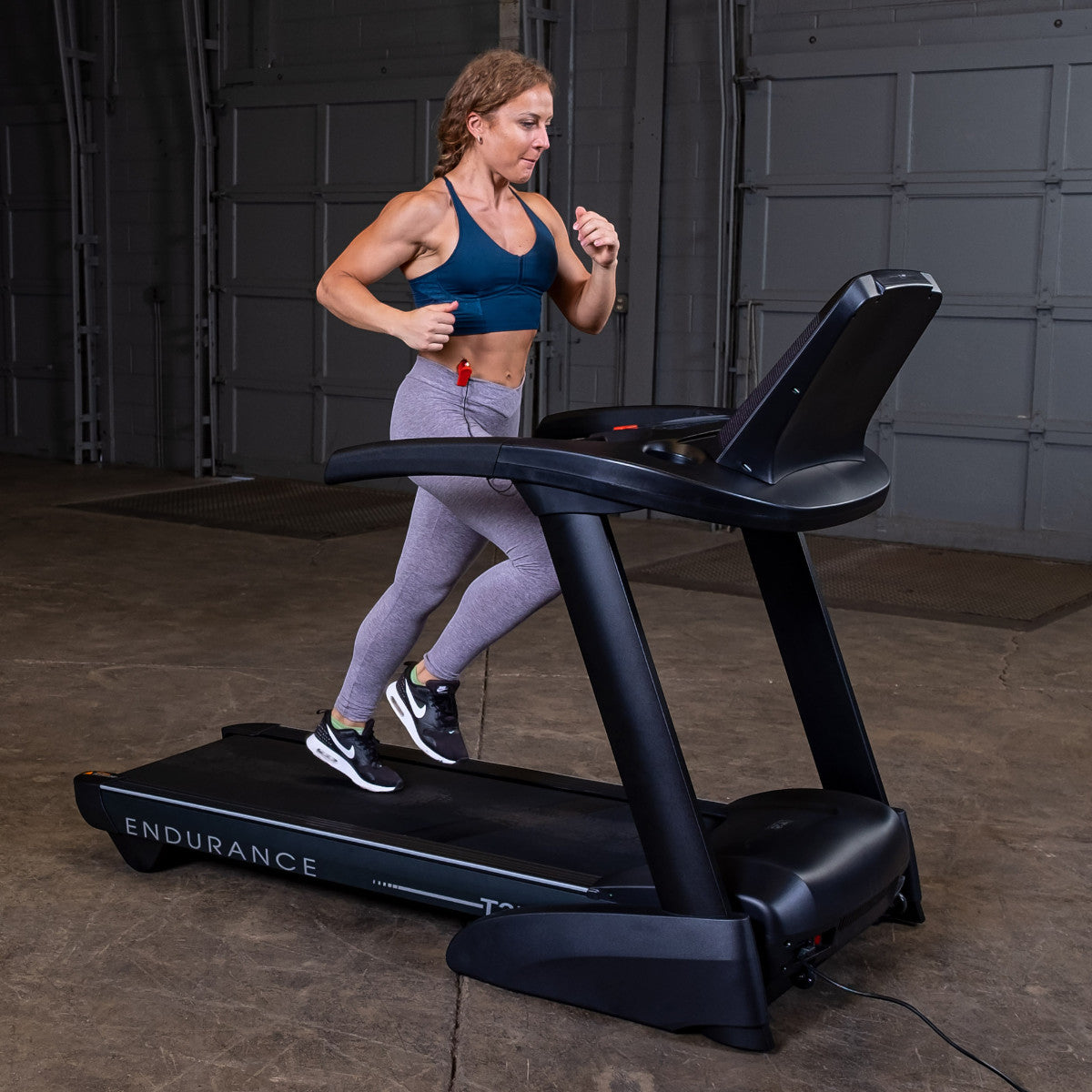 Body-Solid Endurance T25 Folding Treadmill woman running