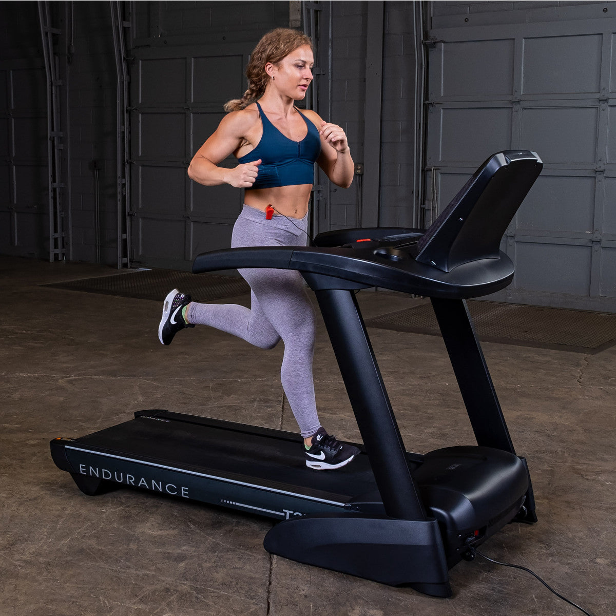 Body-Solid Endurance T25 Folding Treadmill woman running