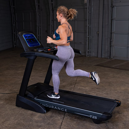 Body-Solid Endurance T25 Folding Treadmill woman running