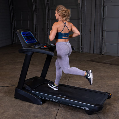 Body-Solid Endurance T25 Folding Treadmill woman running