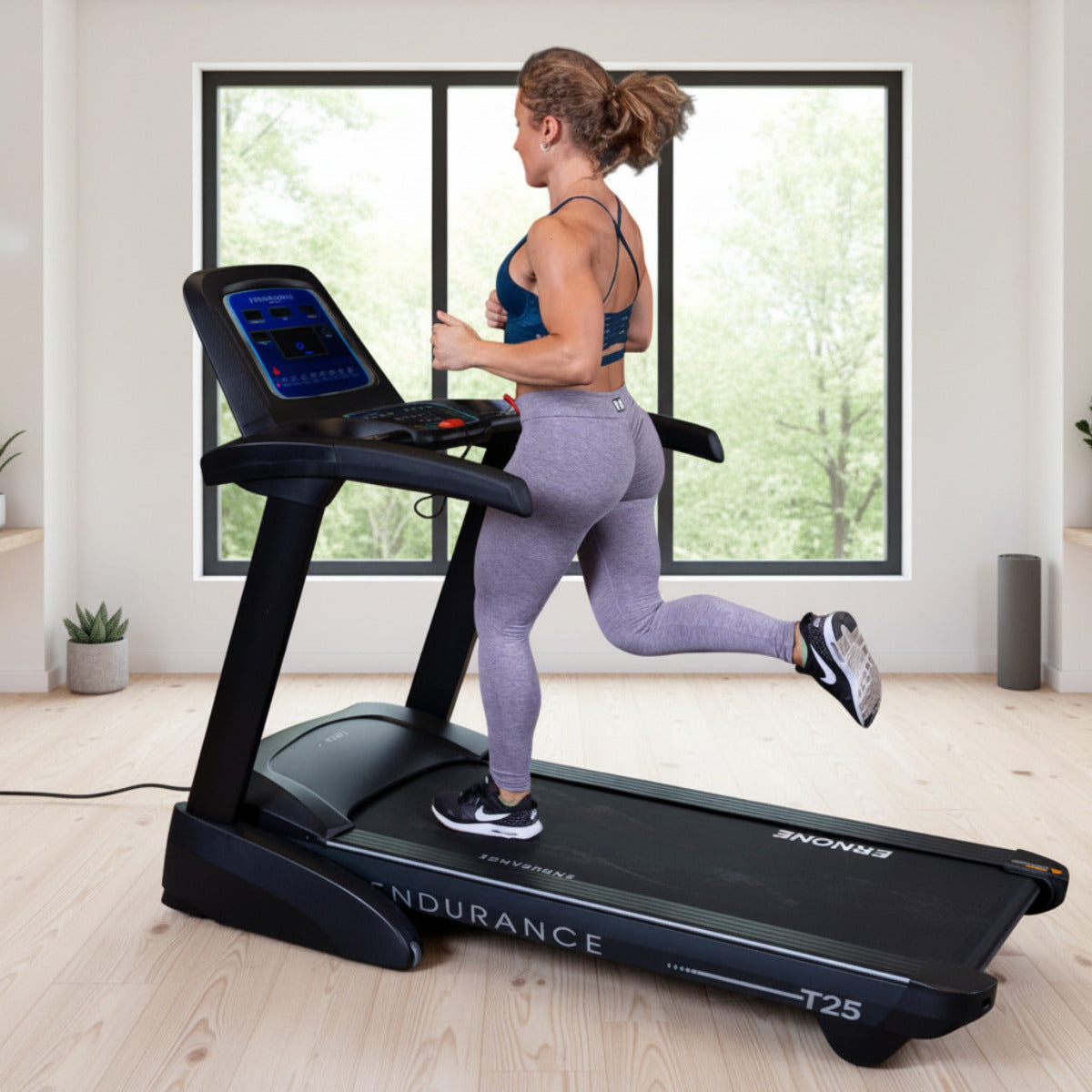 Body-Solid Endurance T25 Folding Treadmill woman running