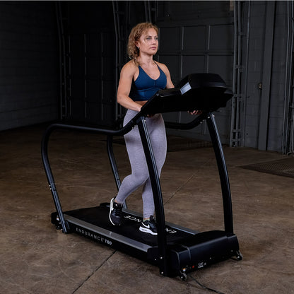 Body-Solid Endurance T50 Walking Treadmill with woman walking