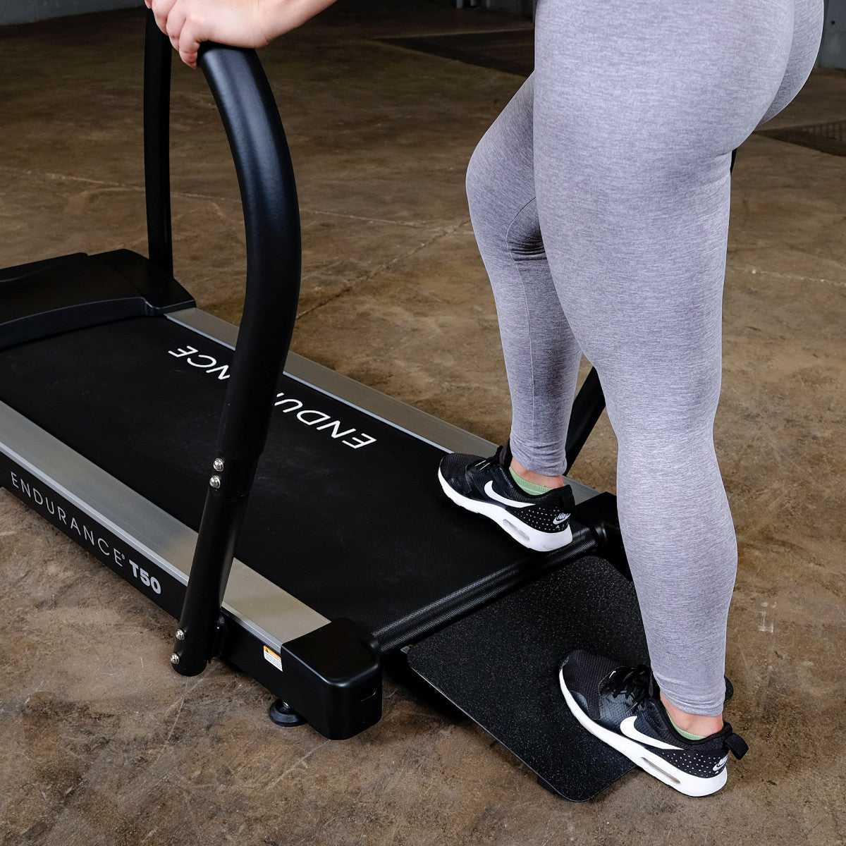 Body-Solid Endurance T50 Walking Treadmill woman stepping on