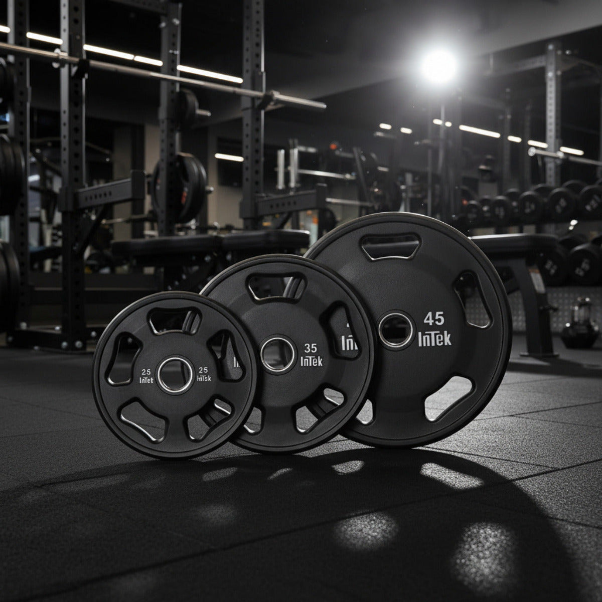 Intek Strength Armor Series Urethane Olympic Plates in gym
