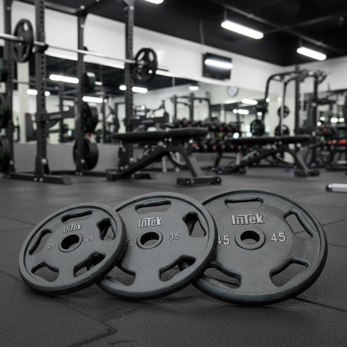 Intek Strength RSO Cast Steel Olympic Plate in gym