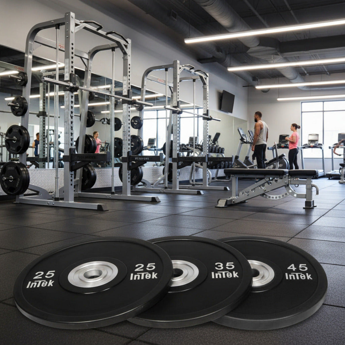 Intek Strength Armor Series IBBN Black Urethane Bumper Plates LBS in gym