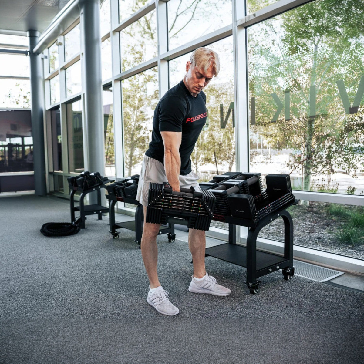 Man lifting PowerBlock Commercial Pro 125 - 175.