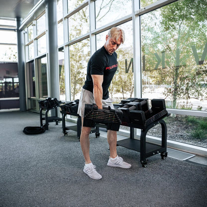 Man lifting PowerBlock Commercial Pro 125 - 175.