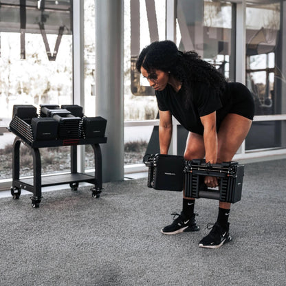 Woman doing Dumbbell Rows with PowerBlock Commercial Pro 175.