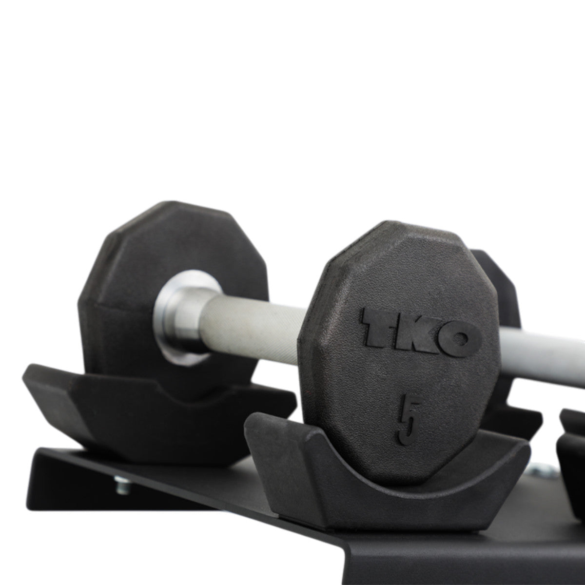TKO 7051B-BK 10 Pair Dumbbell Saddle Rack with dumbbells close up on white background