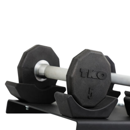 TKO 7051B-BK 10 Pair Dumbbell Saddle Rack with dumbbells close up on white background