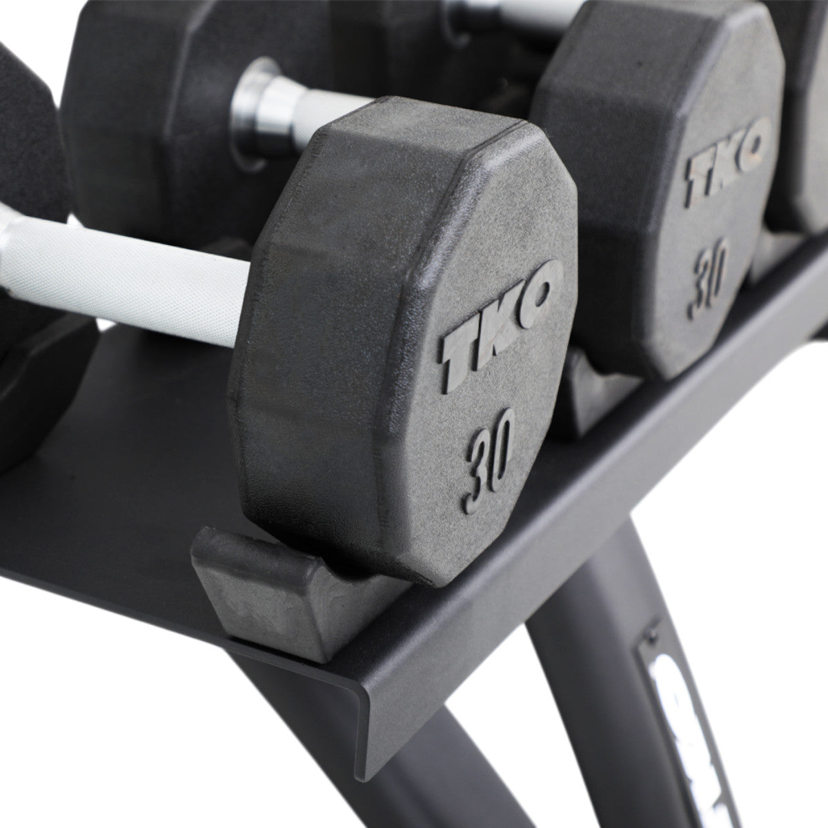 TKO 7051B-BK 10 Pair Dumbbell Saddle Rack with dumbbells close up on white background