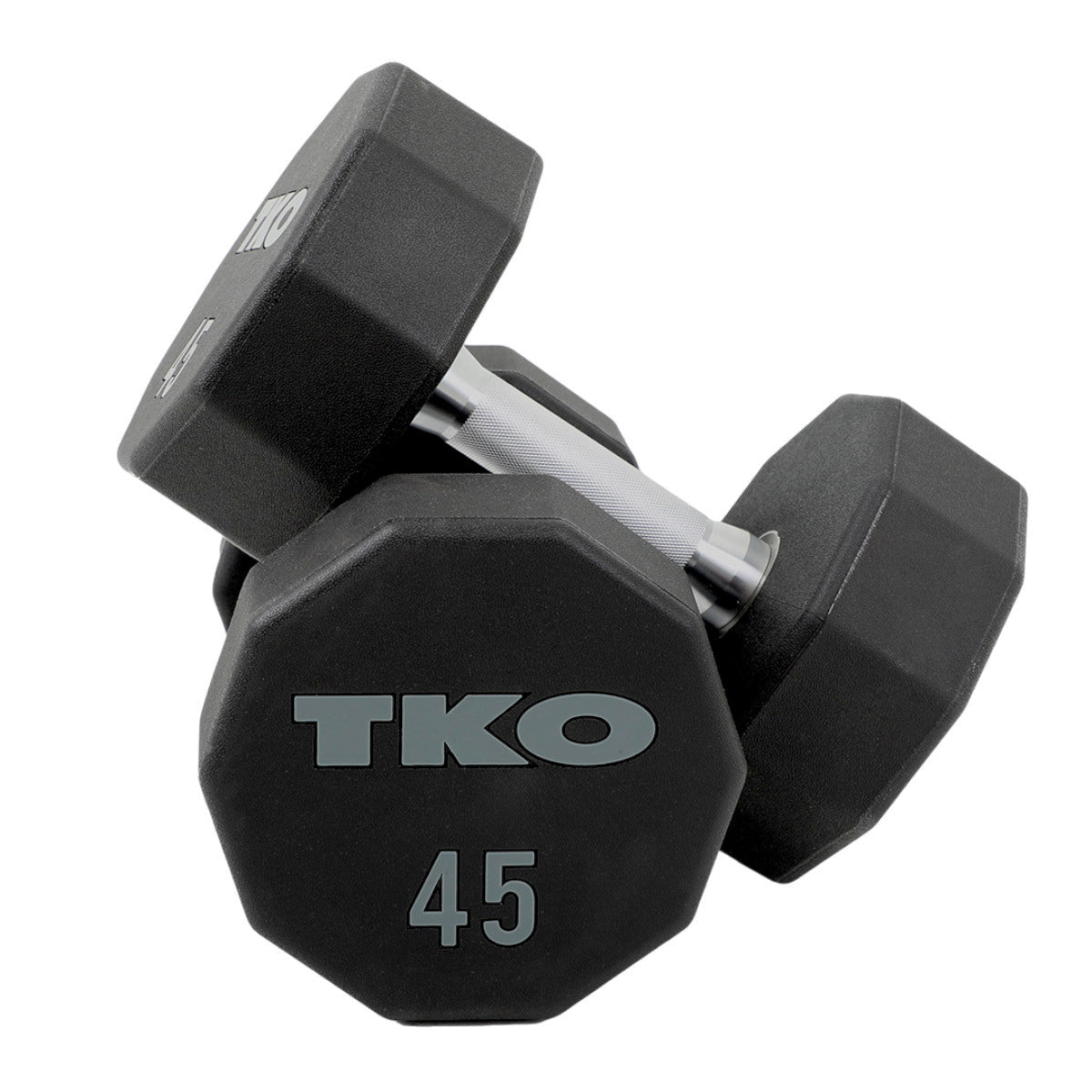 Pair of TKO dumbbells on a gym floor with white background.