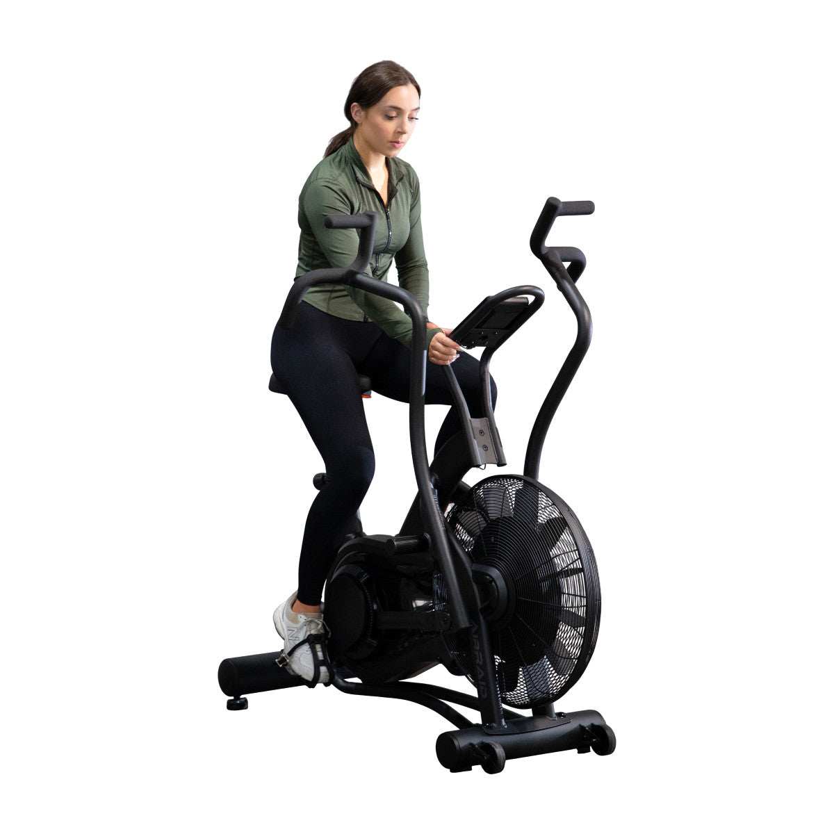 Woman exercising on TKO 8AB AirRaid Bike with a white background