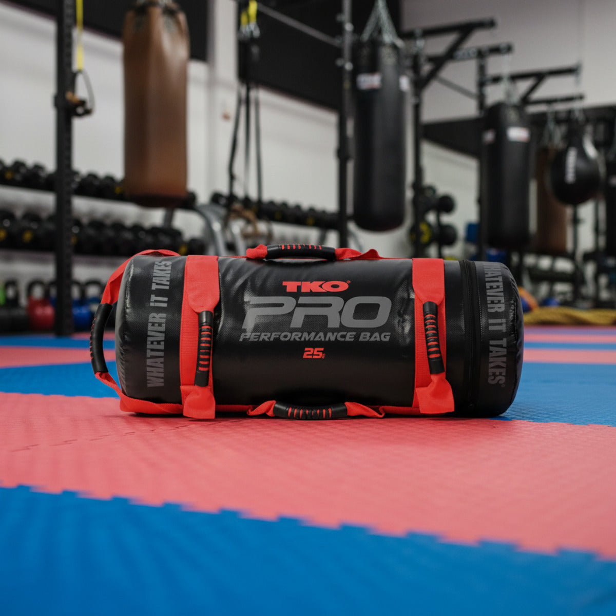 Black and red TKO Pro performance bag in gym