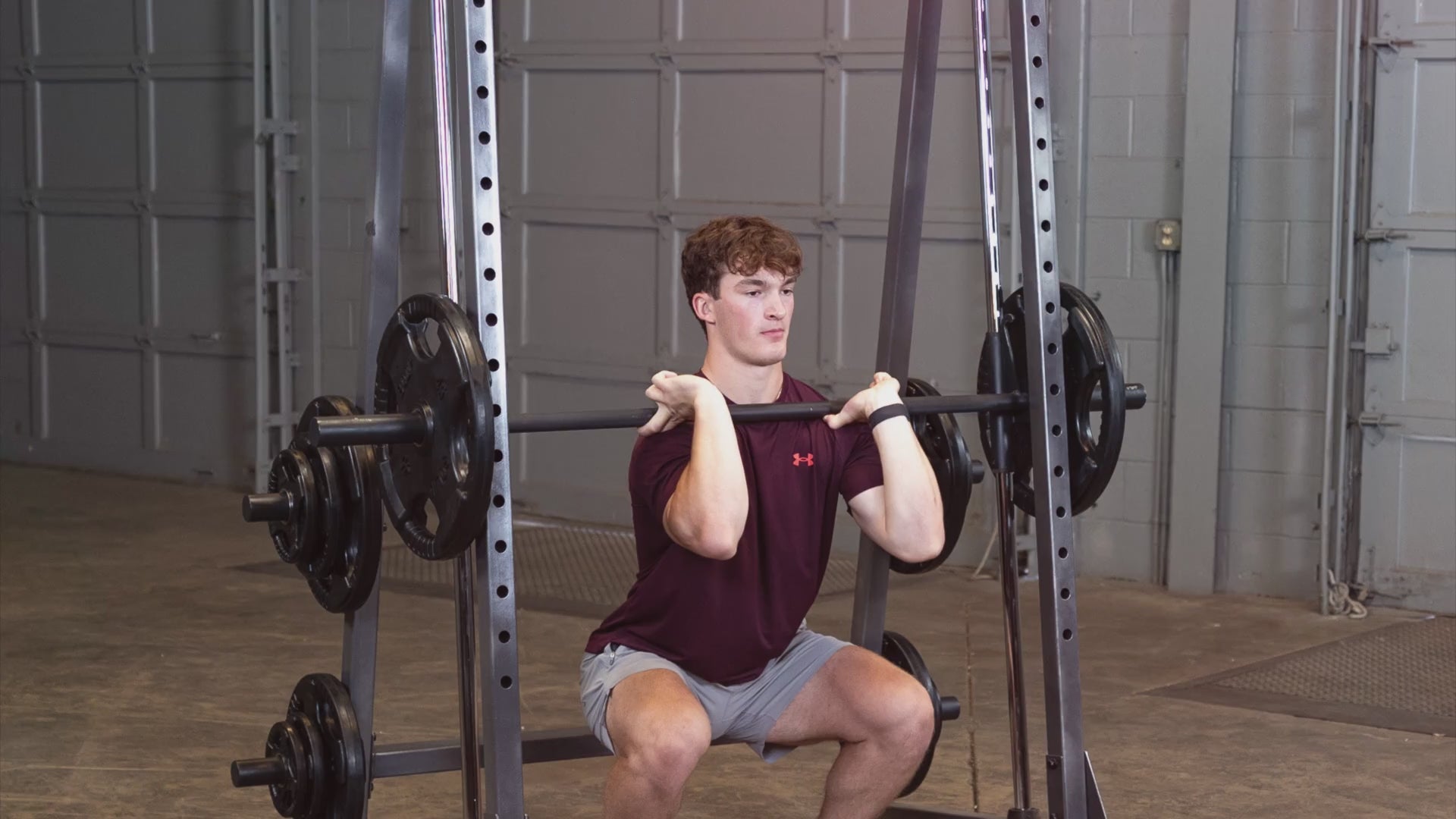 Body-Solid Powerline PSM200 Smith Machine man exercising
