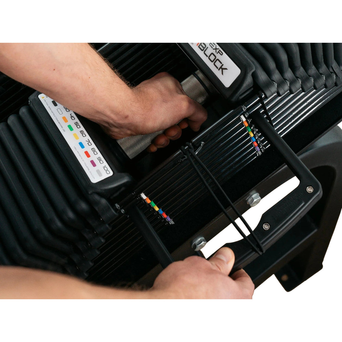PowerBlock Pro 100 EXP Adjustable Dumbbells weight adjustment.